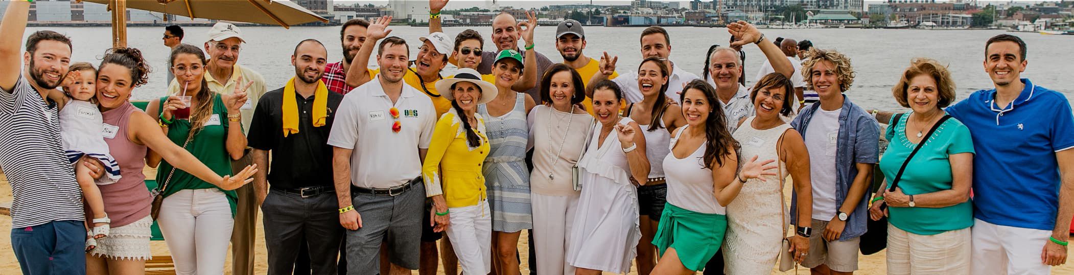 Wide panoramic picture of the entire H&S Bakery Paterakis family in Baltimore Maryland at the Sand Lot beach